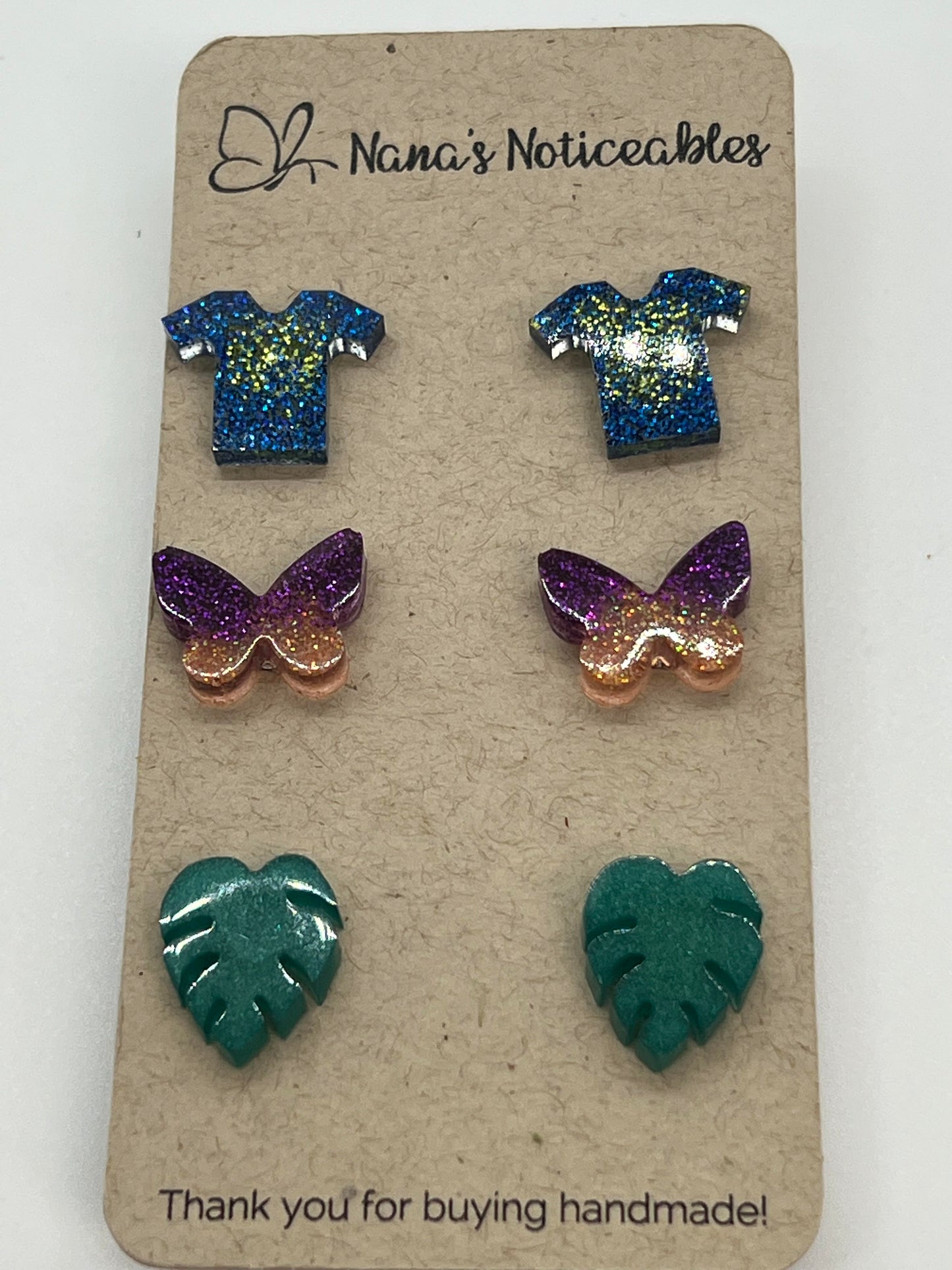 RESIN 3 POST PACK OF GLITTER EARRINGS BLUE/GREEN T-SHIRT, PURPLE/ORANGE BUTTERFLY AND GREEN LEAVES