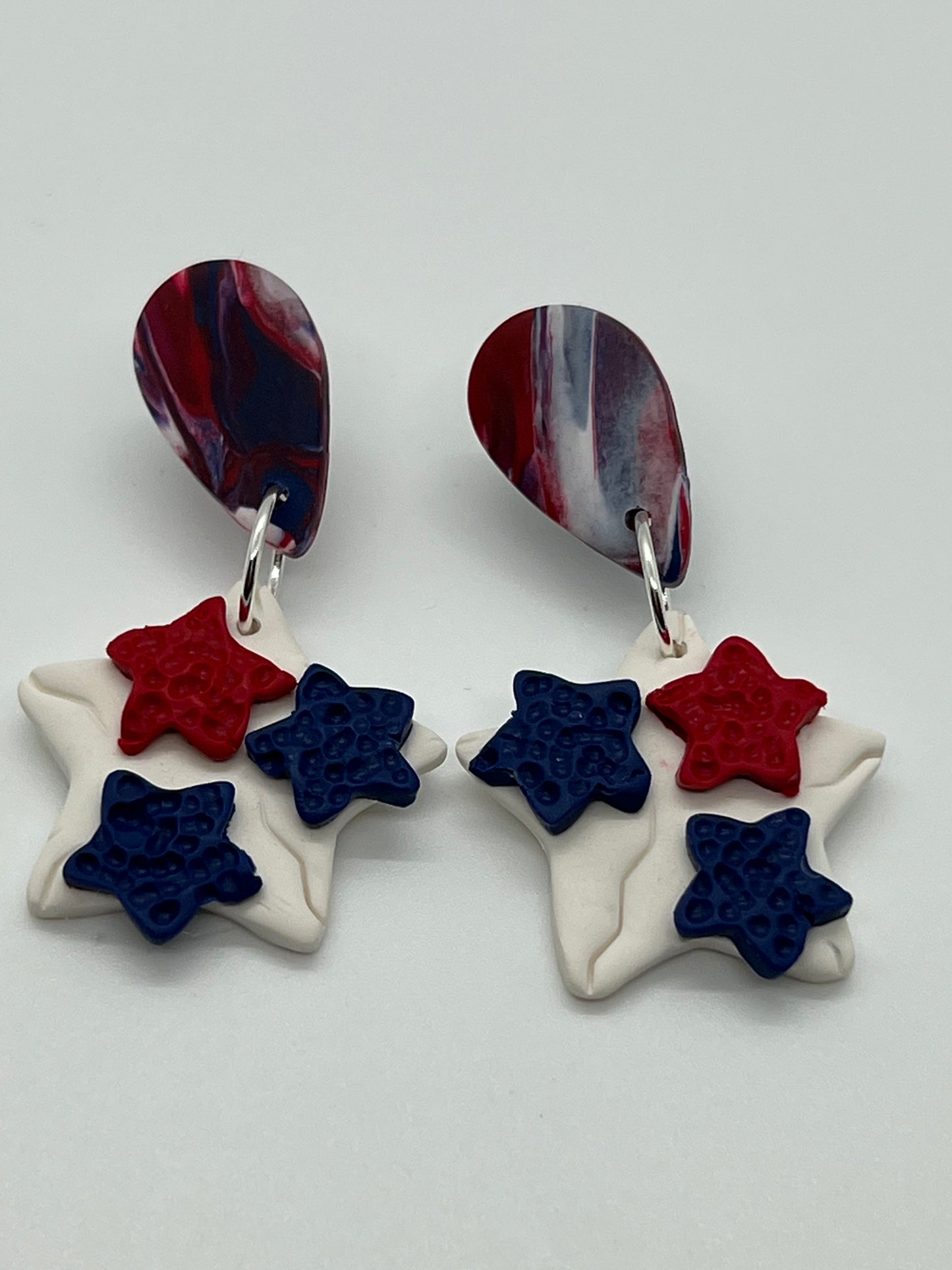 POLYMER STAR WITH TEAR DROP POST IN RED, WHITE & BLUE