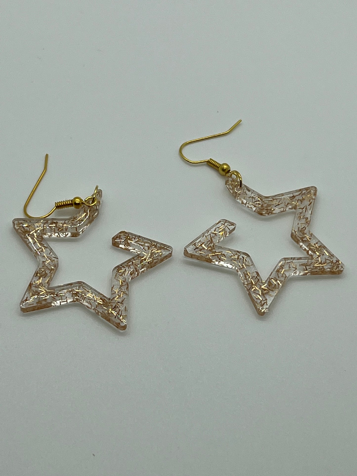 RESIN OPEN STAR TRANSLUCENT GOLD GLITTER