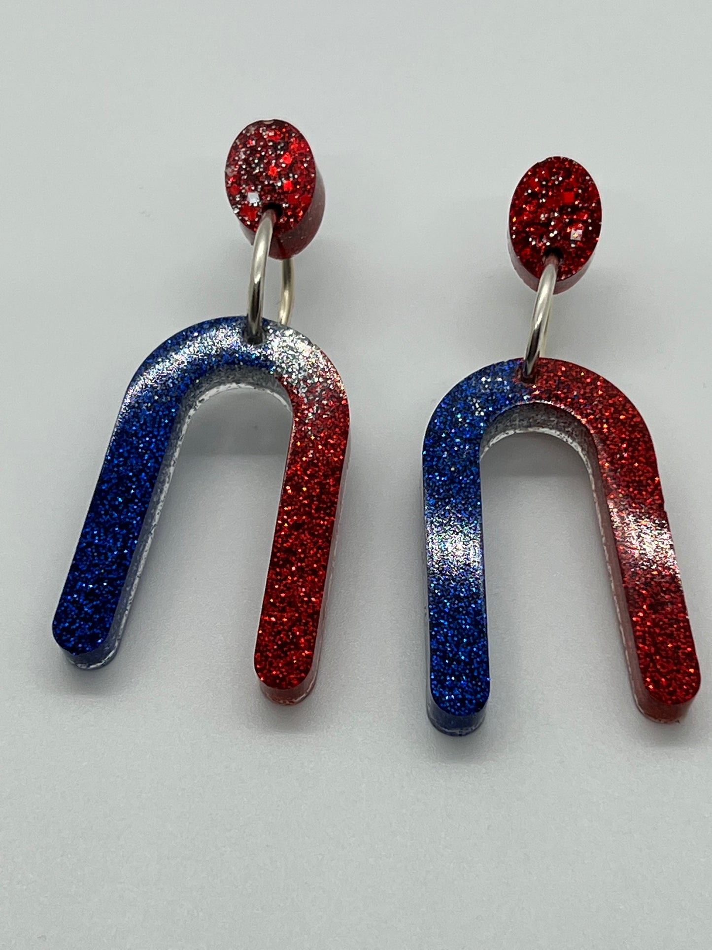 RESIN RAINBOW WITH OVAL POST IN RED,WHITE & BLUE