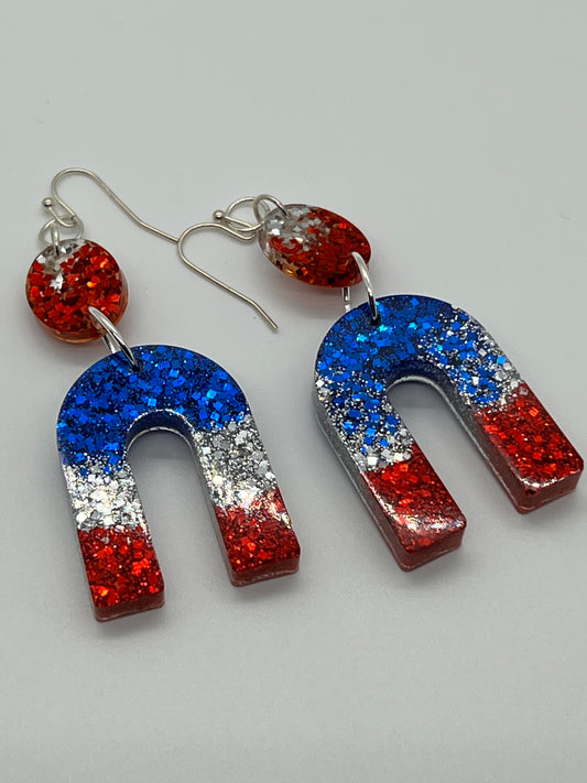 RESIN RAINBOW ON OVAL DROP IN RED,WHITE & BLUE GLITTER