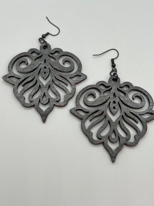 WOOD CUT OUTS STAINED IN AN ANTIQUE GRAY