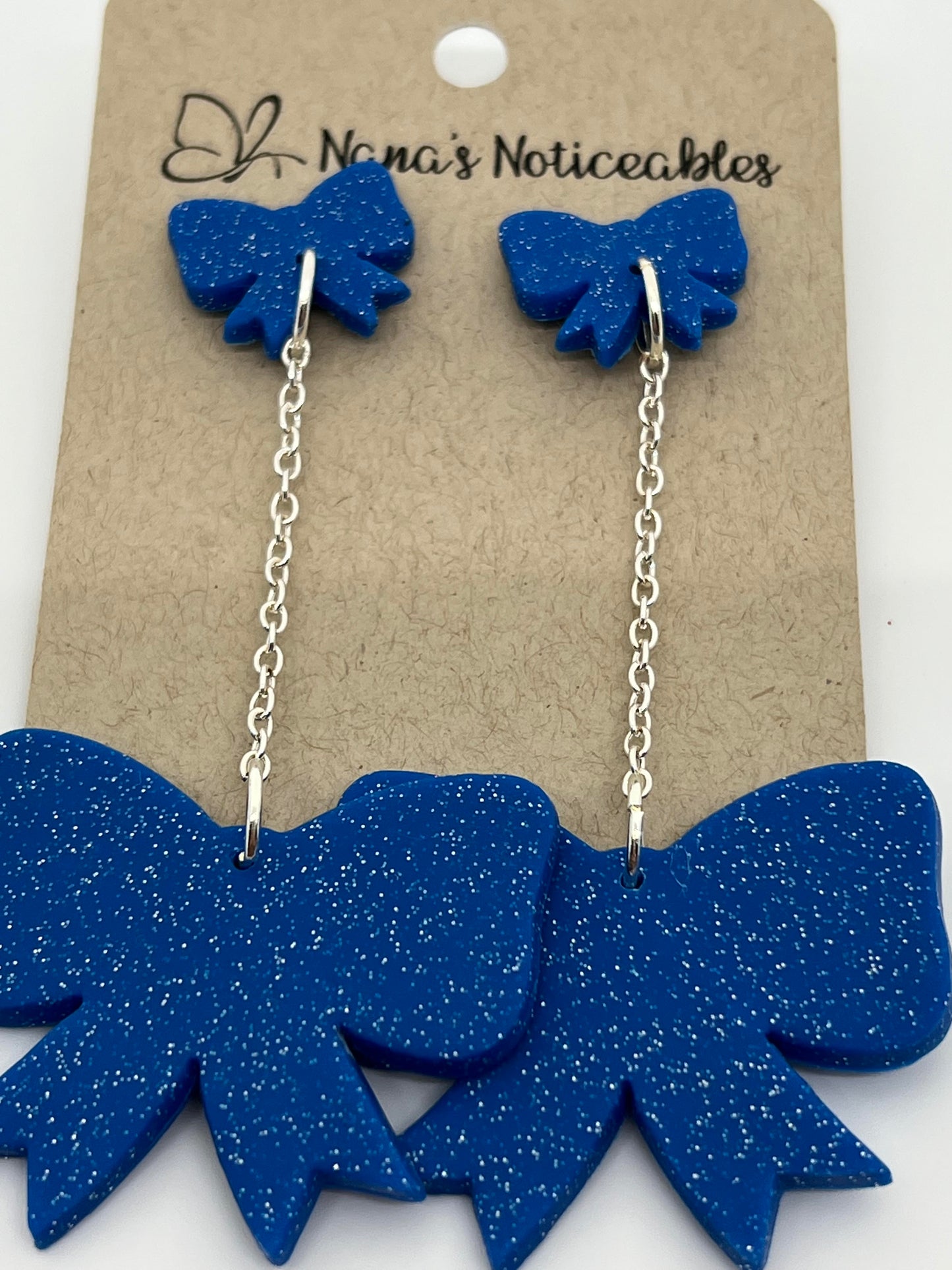 POLYMER DOUBLE BOW DROP ON CHAIN IN SPARKLE BLUE