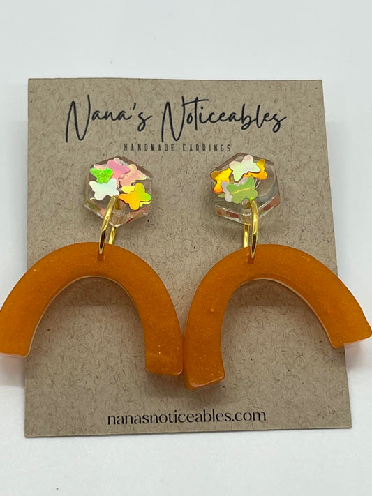 RESIN BUTTERFLIES ATTACHED TO AN ORANGE RAINBOW